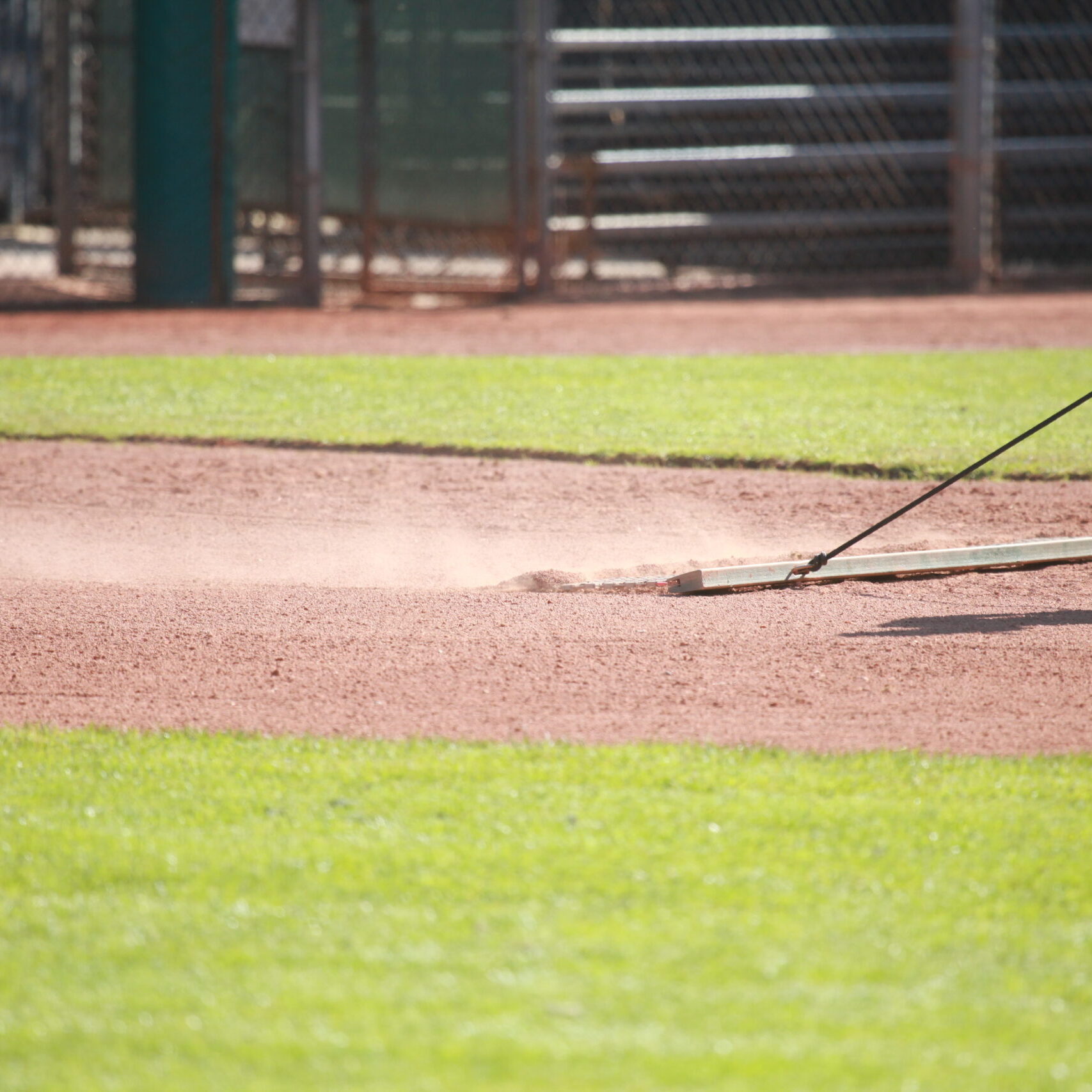 Dragging baseball infield, sports field dust